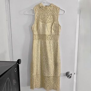 Bebe white lace bodycon dress with gold detail. Size 0.